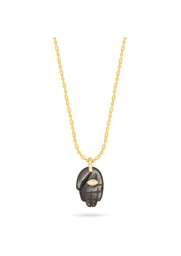black hand pendant on a gold chain, with a gemstone in the centre, as a flat lay image on a plain white background 