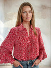 Ditsy print shirt with balloon sleeves worn with blue denim from Sirens
