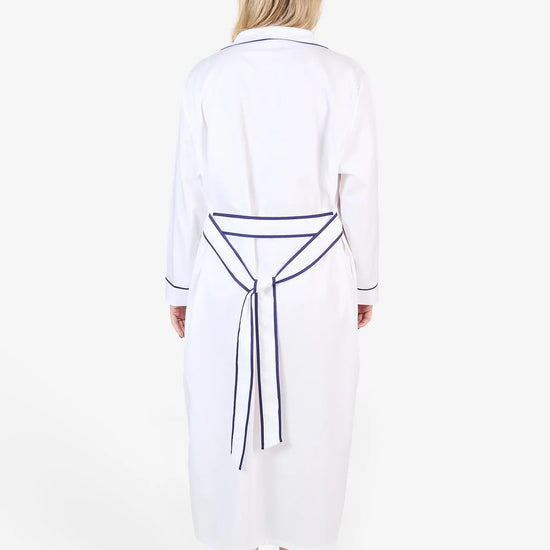 White herringbone organic cotton robe with navy trim long sleeves and front patch pocket