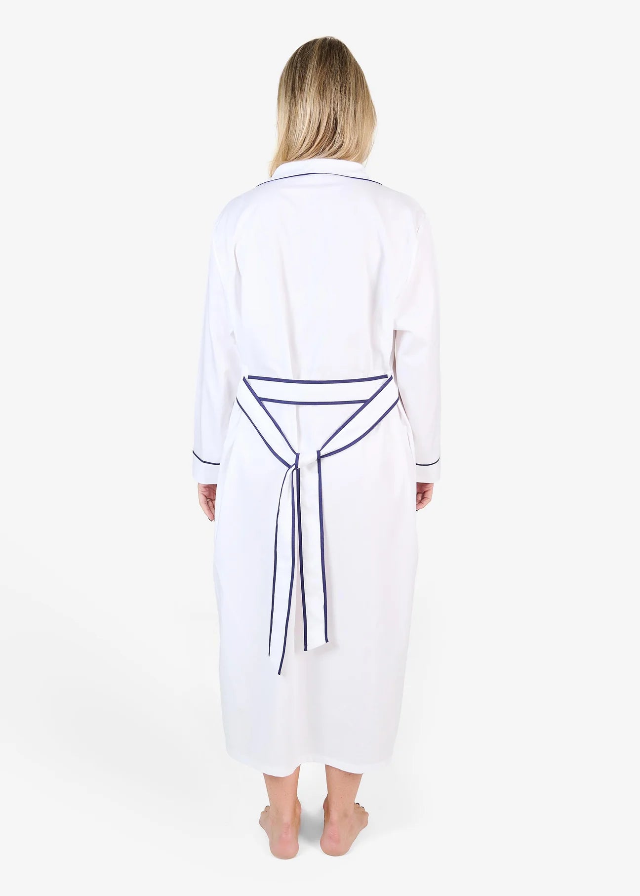 White herringbone organic cotton robe with navy trim long sleeves and front patch pocket