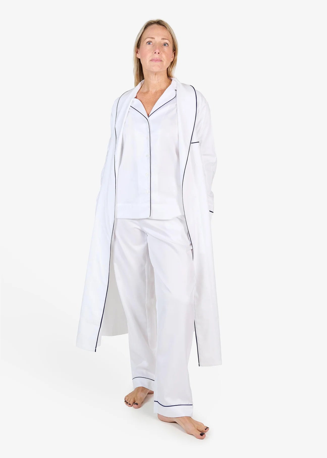 White herringbone organic cotton robe with navy trim long sleeves and front patch pocket