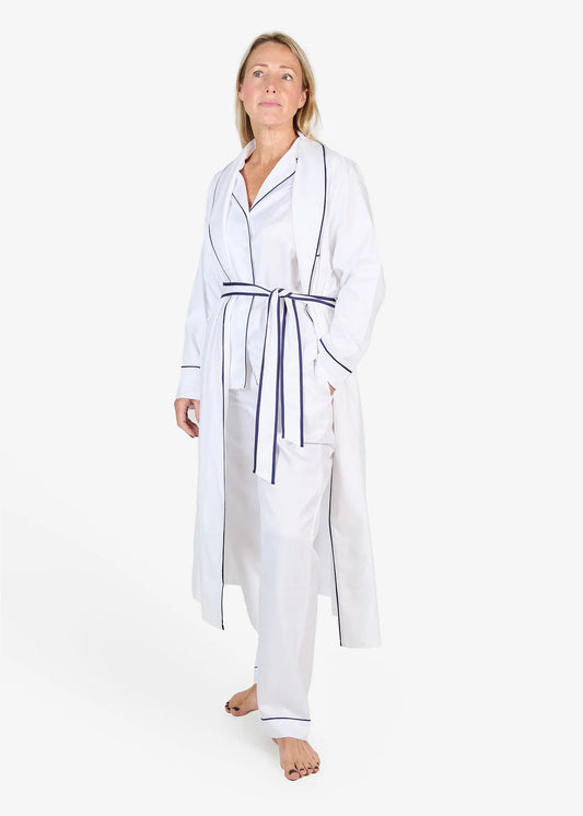 White herringbone organic cotton robe with navy trim long sleeves and front patch pocket