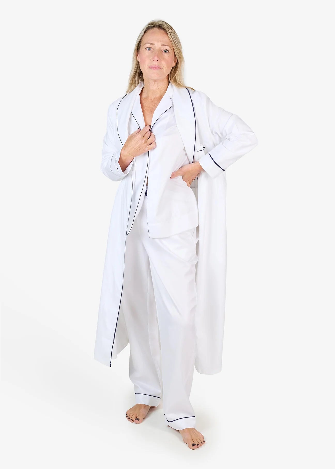 White herringbone organic cotton robe with navy trim long sleeves and front patch pocket