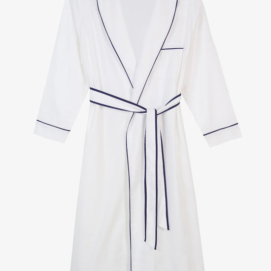 White herringbone organic cotton robe with navy trim long sleeves and front patch pocket