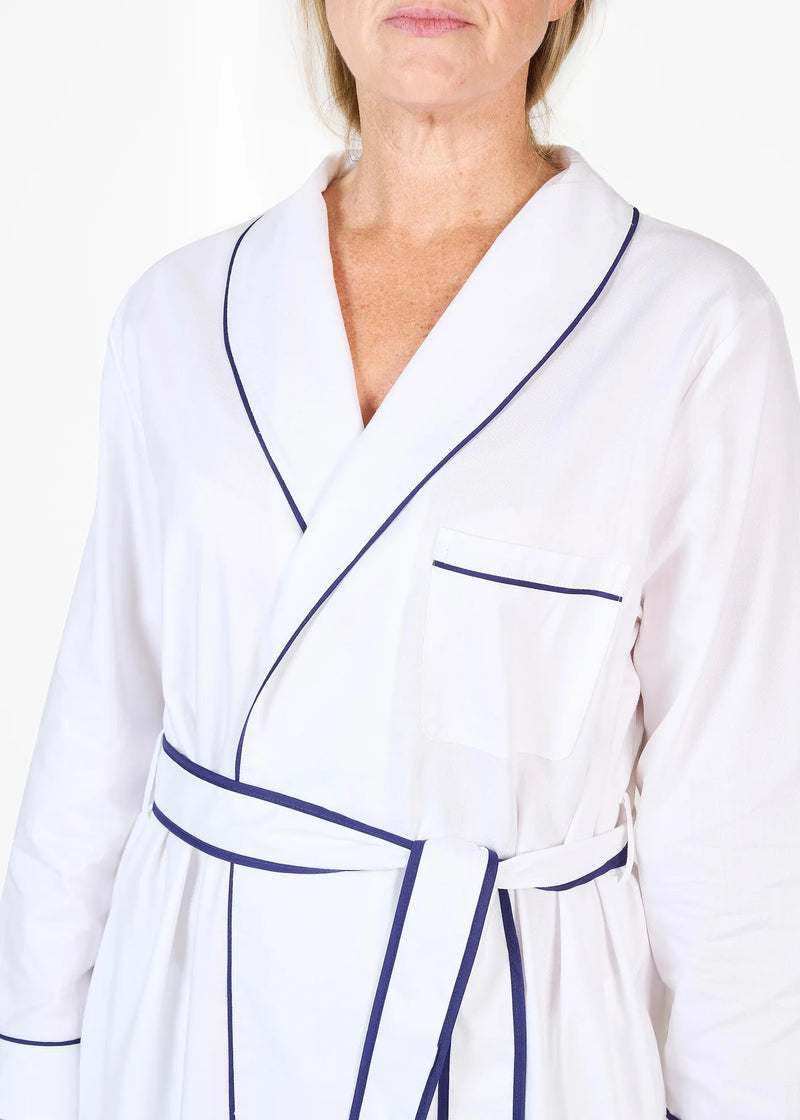 White herringbone organic cotton robe with navy trim long sleeves and front patch pocket