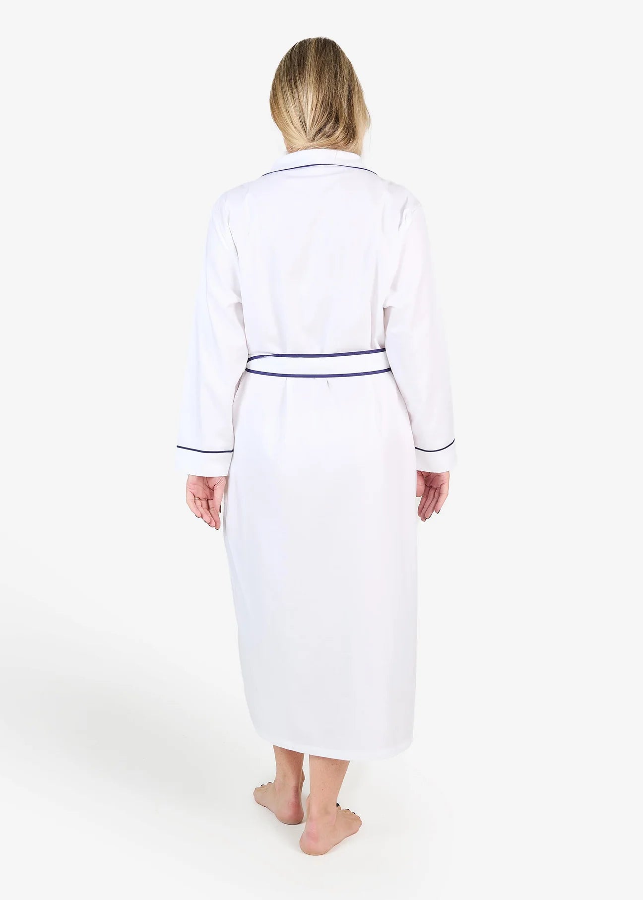 White herringbone organic cotton robe with navy trim long sleeves and front patch pocket