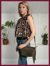leopard print faux fur sleeveless gilet with round neck and hook fastening model shot