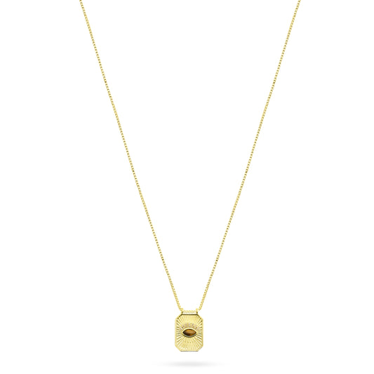 Gold necklace with a hexagonal pendant on a white background