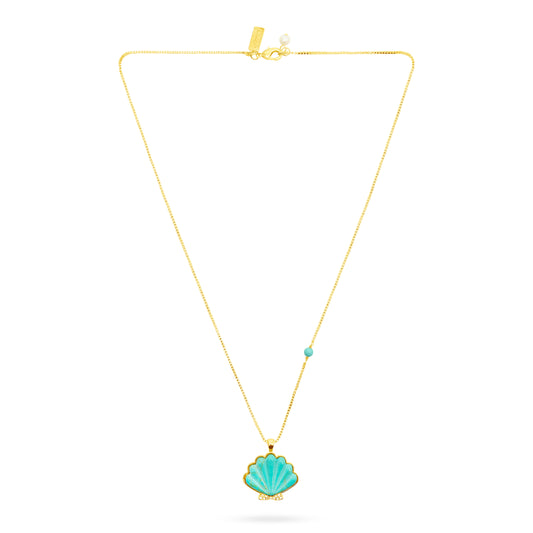 Gold necklace with a turquoise shell pendant on a white background