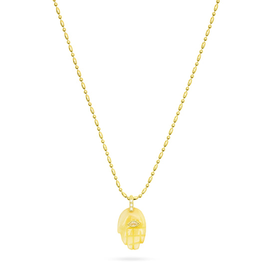 Gold necklace with a unique pendant on a white background from Talis Chains
