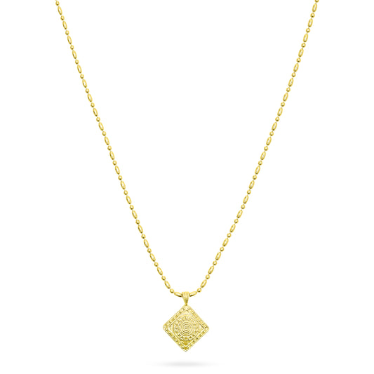 Gold necklace with a decorative pendant on a white background