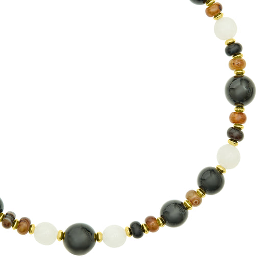 Close up of beads and gold details Tigers eye black agate and white opal