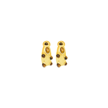 Gold earrings with brown stones on a white background