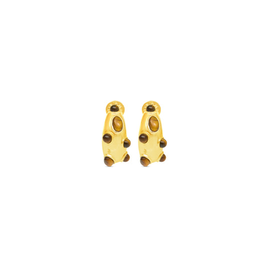 Gold earrings with brown stones on a white background
