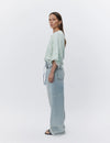 mint round neck boxy blouse with wide sleeves and fringe detailing  side view 