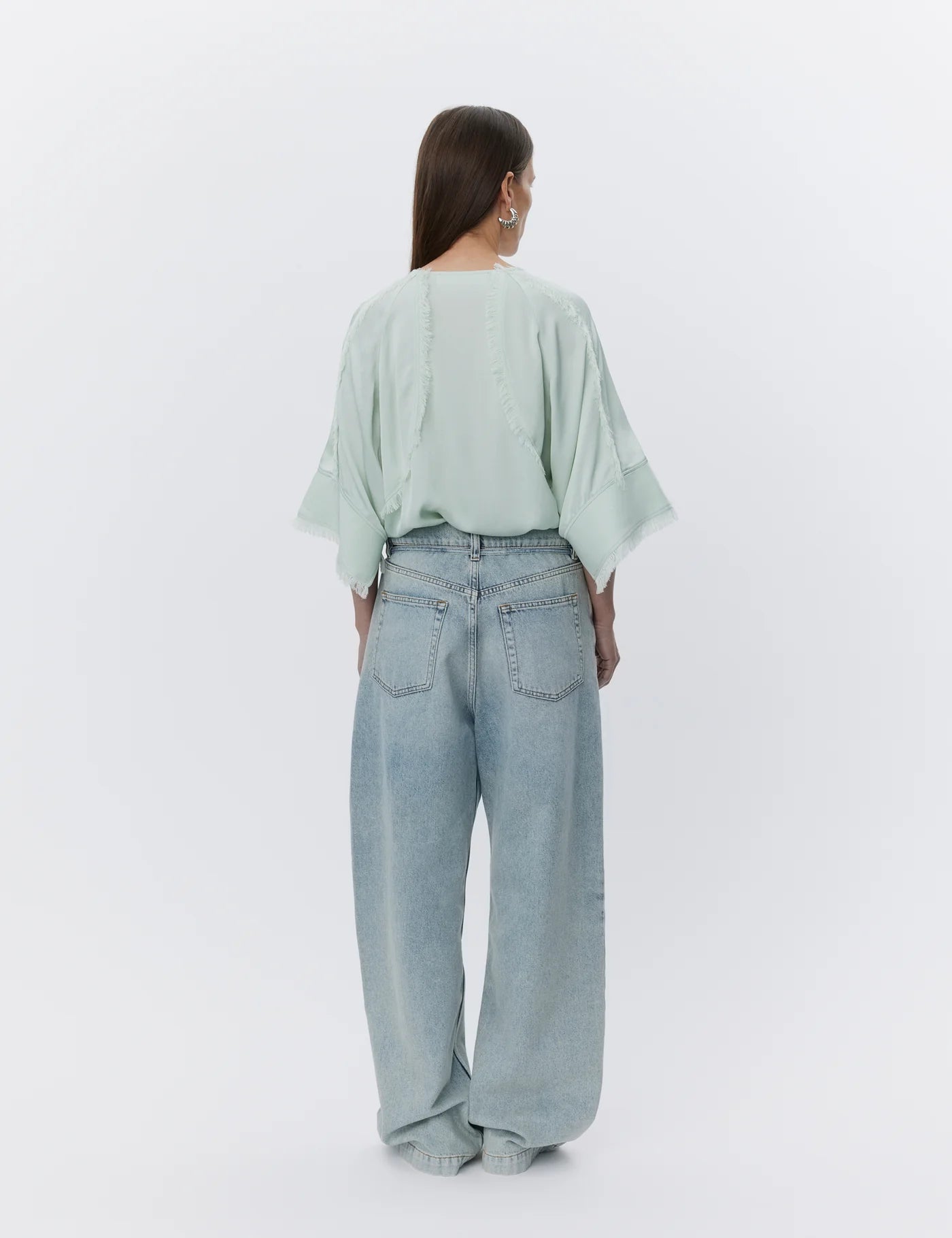 mint round neck boxy blouse with wide sleeves and fringe detailing  rear view 