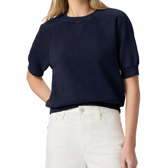 model wearing a navy blue short sleeve sweatshirt on a plain white background 