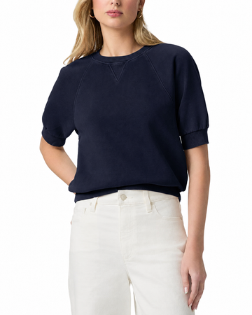 model wearing a navy blue short sleeve sweatshirt on a plain white background 