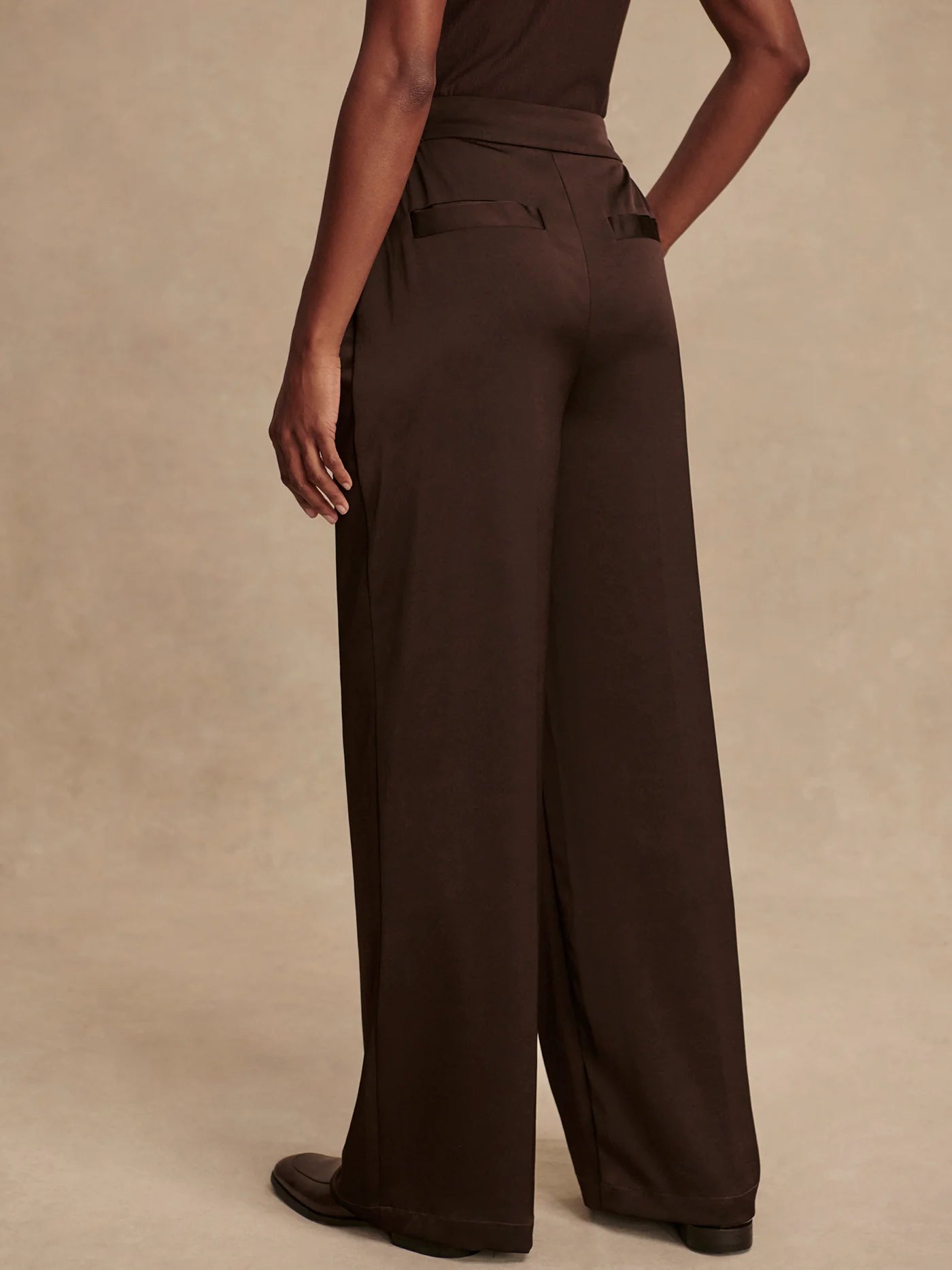 wide leg elasticated waist chocolate brown sateen trousers rear view