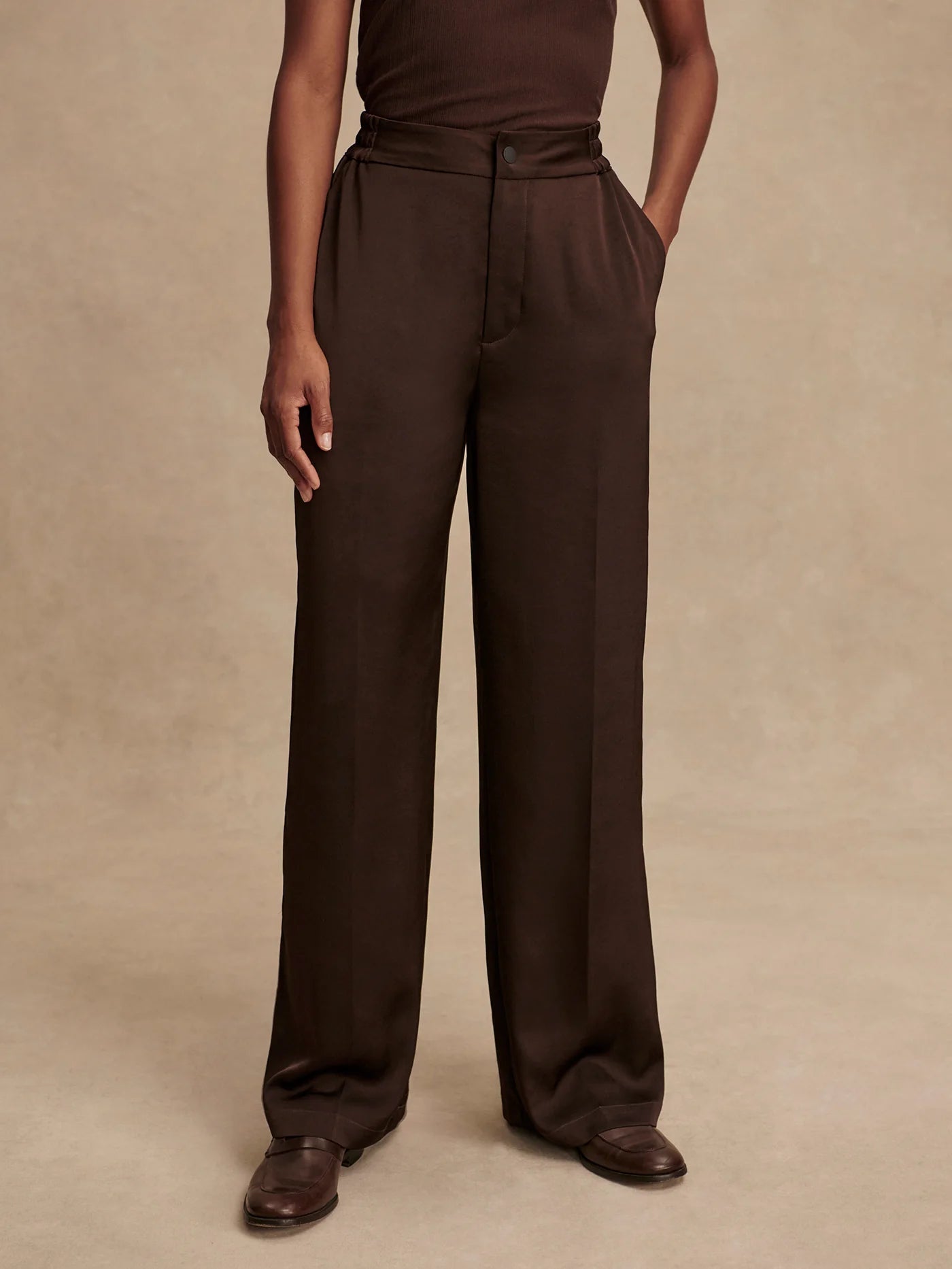 wide leg elasticated waist chocolate brown sateen trousers model shot