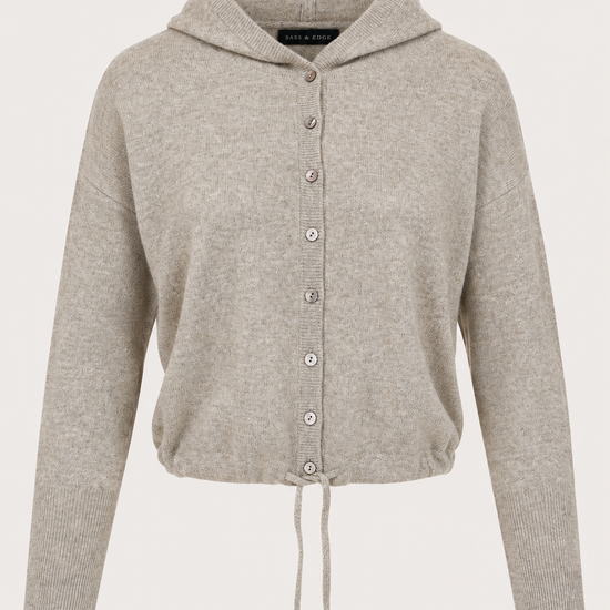 flat kay of a hooded cropped knit in a light brown colour with buttons through the front, and a drawstring at the hem