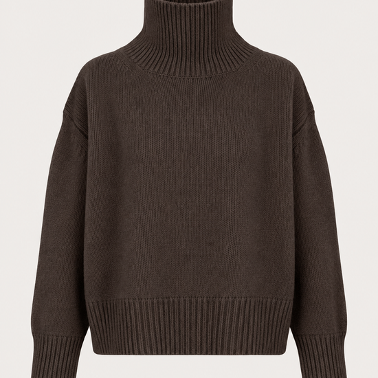 A dark brown ribbed-knit turtleneck sweater with dropped shoulders, displayed on a clean, light off-white background.