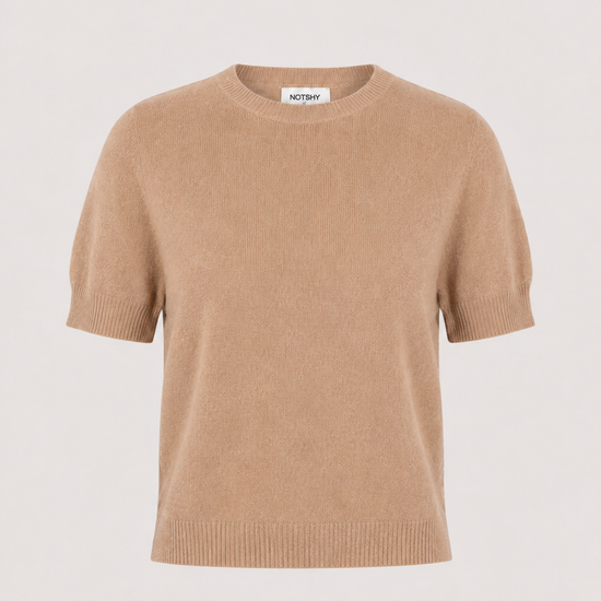 A short-sleeve crewneck knit sweater in a warm camel beige color, displayed against a solid light gray background.