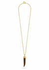 A gold chain necklace featuring a pendant made from a polished tiger's eye or tortoiseshell bone with a gold cap, displayed on a clean white background.
