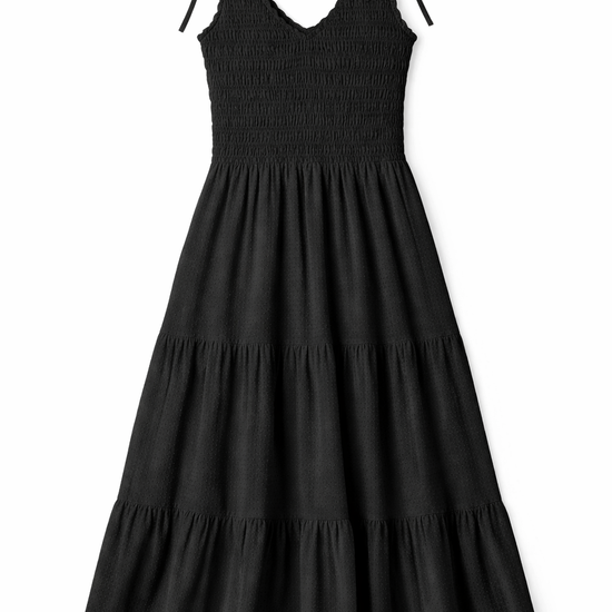 Black tiered maxi dress with smocked bodice, ruffled V-neckline and shoulder ties in lightweight fabric.