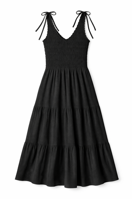 Black tiered maxi dress with smocked bodice, ruffled V-neckline and shoulder ties in lightweight fabric.