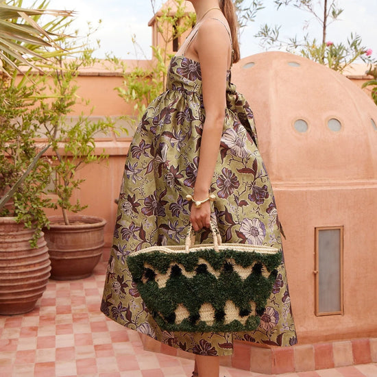 spaghetti strap mid length floral green dress from alemais side view