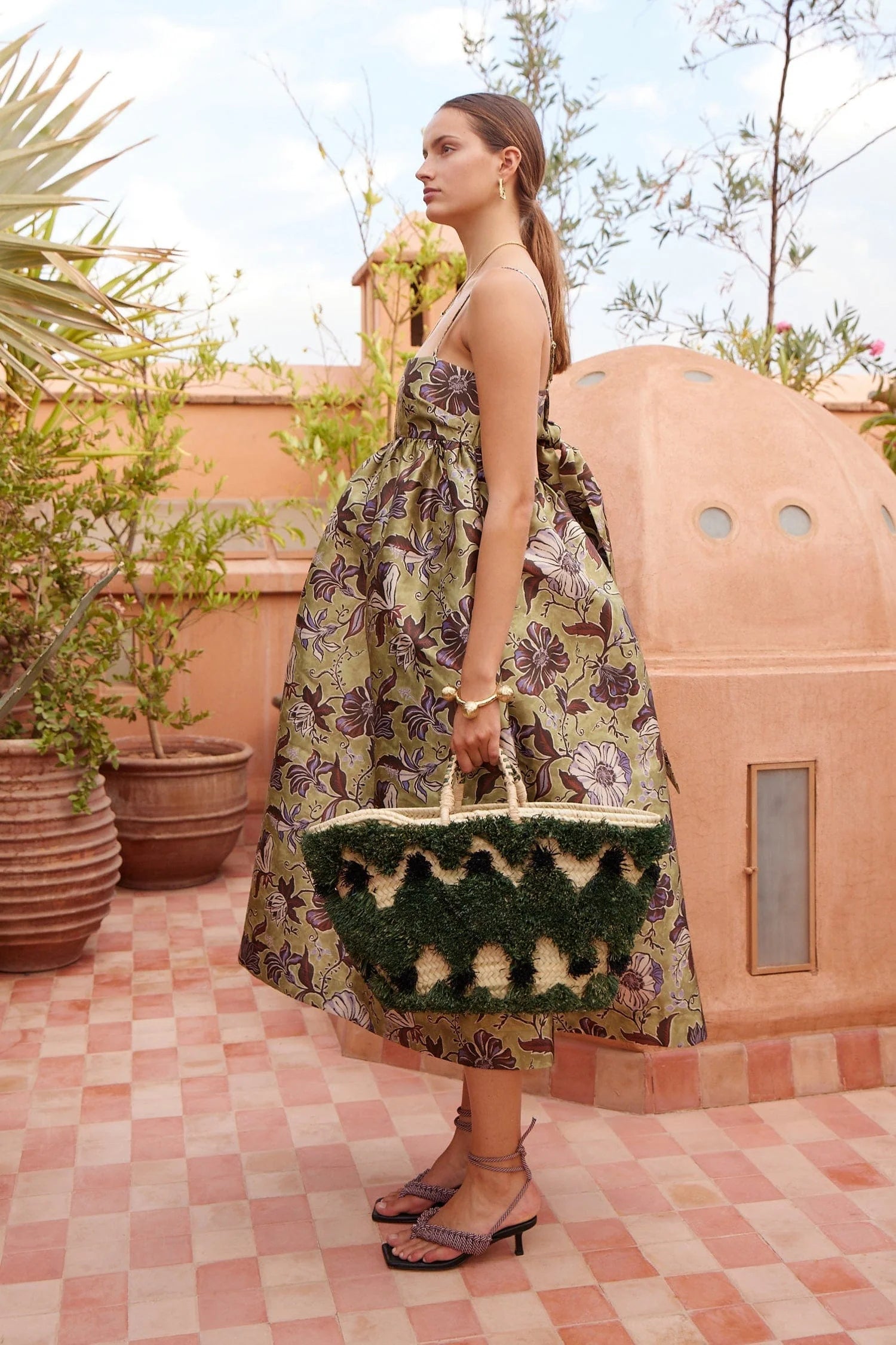 spaghetti strap mid length floral green dress from alemais side view