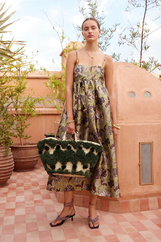 spaghetti strap mid length floral green dress from alemais model shot