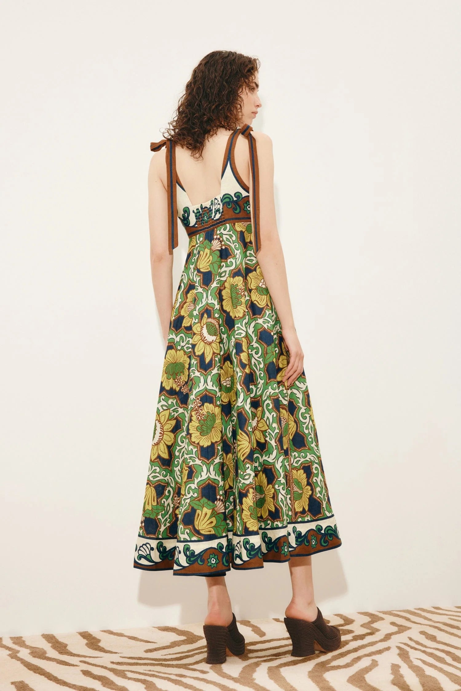 Rear view of linen dress on model from Alemais