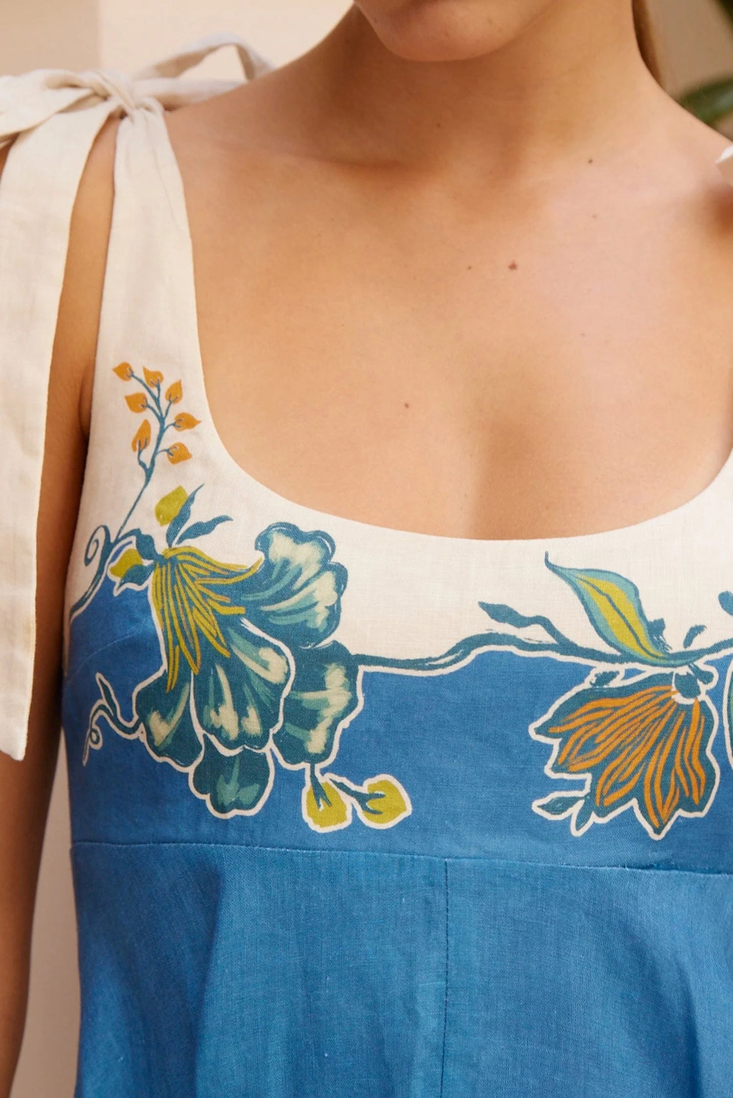 tie strap midi dress with blue and cream flora print from alemais close up
