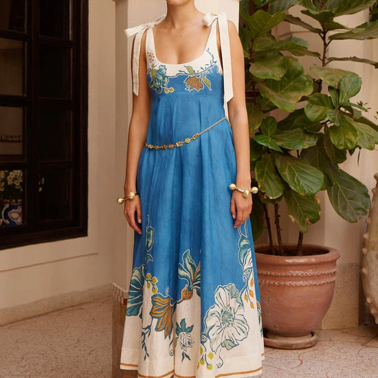 tie strap midi dress with blue and cream flora print from alemais model shot