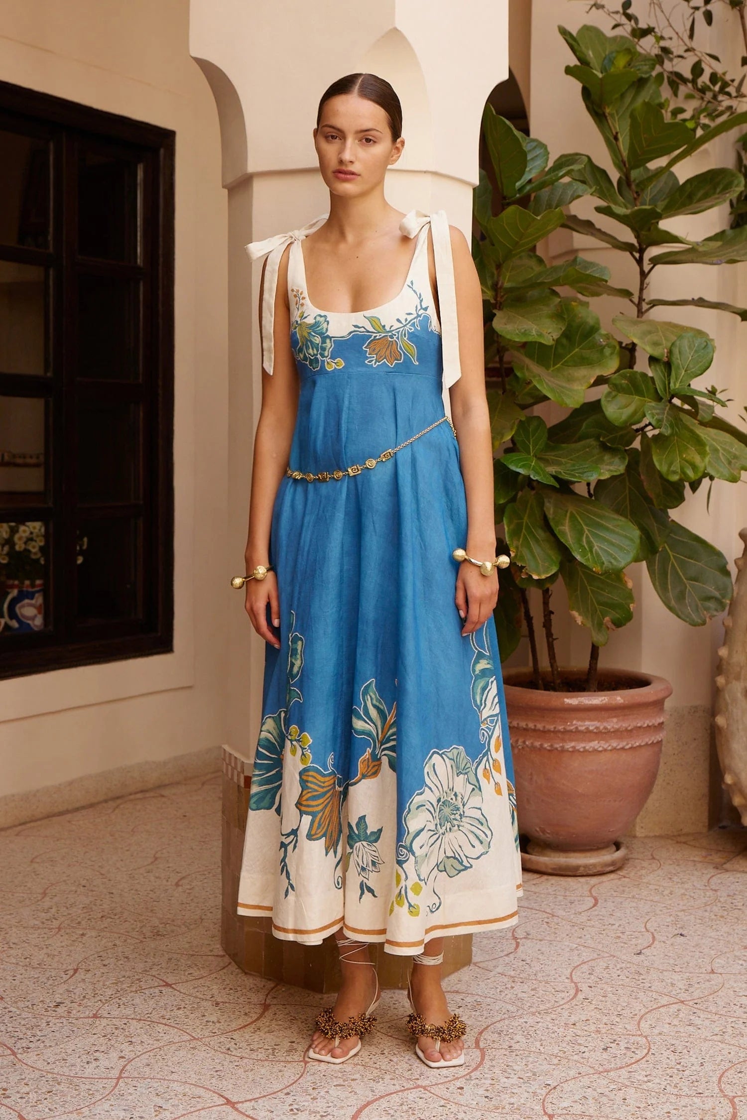 tie strap midi dress with blue and cream flora print from alemais model shot