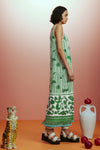 Sleeveless green printed sun dress with fringe detail on the hem side view 