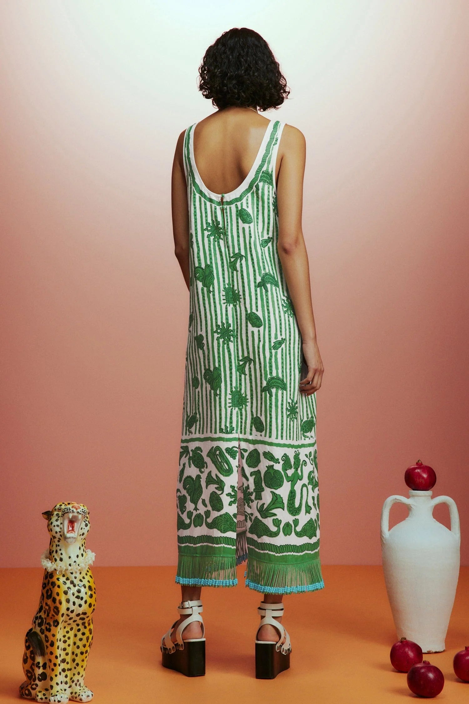 Sleeveless green printed sun dress with fringe detail on the hem rear view 