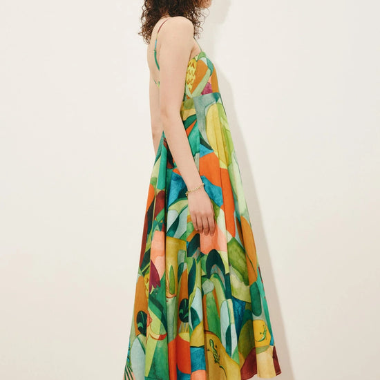 Side view of green print linen dress from Alemais