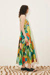 Side view of green print linen dress from Alemais