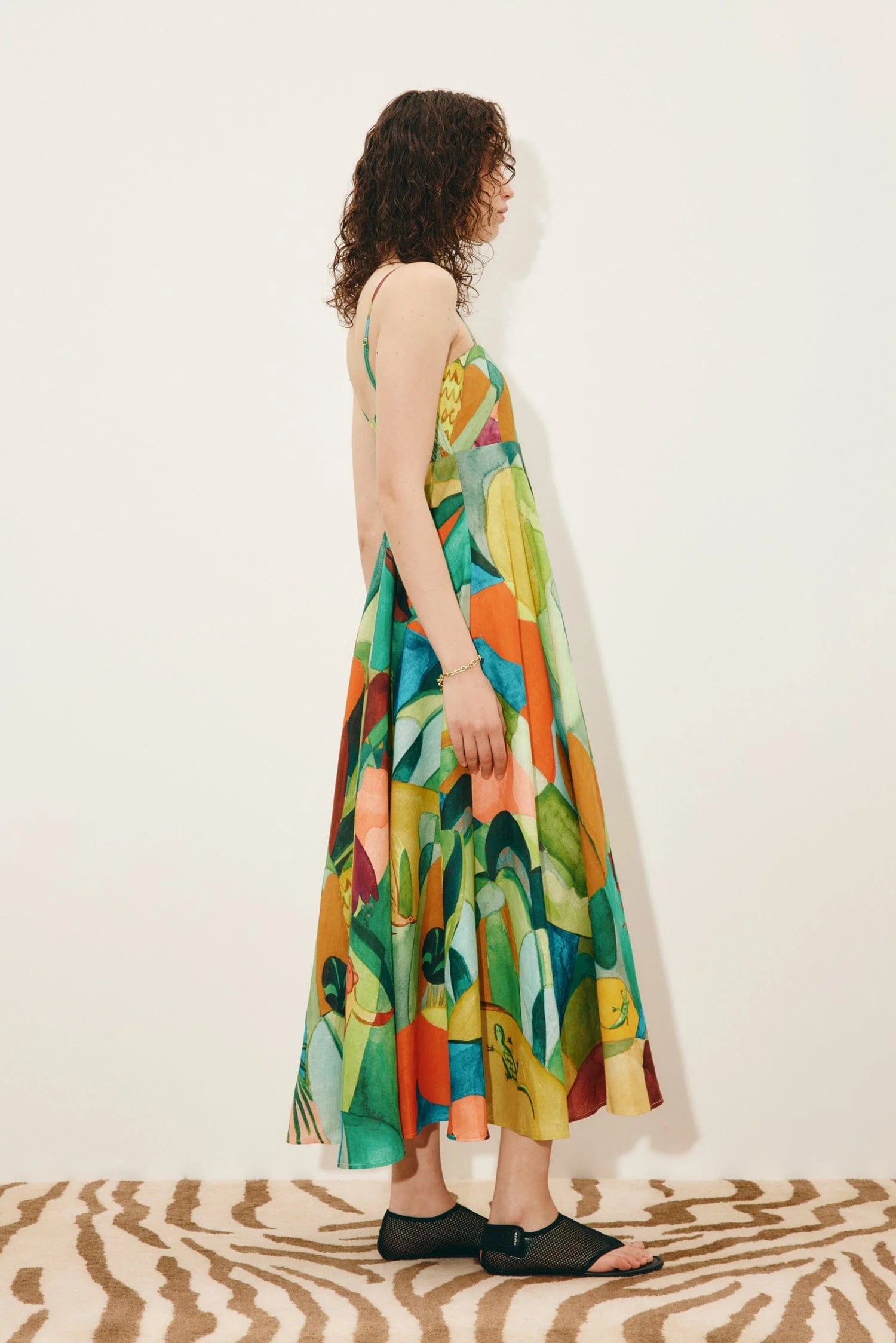 Side view of green print linen dress from Alemais