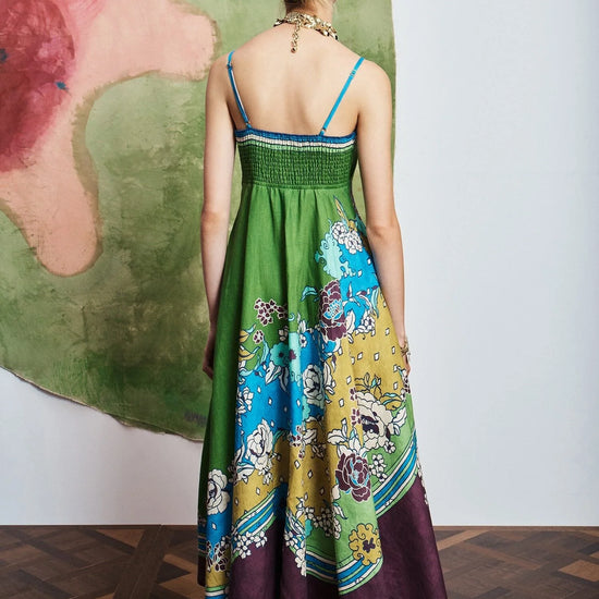 Woman wearing pattern maxi dress by Alemais rear view