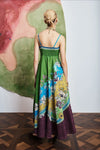Woman wearing pattern maxi dress by Alemais rear view