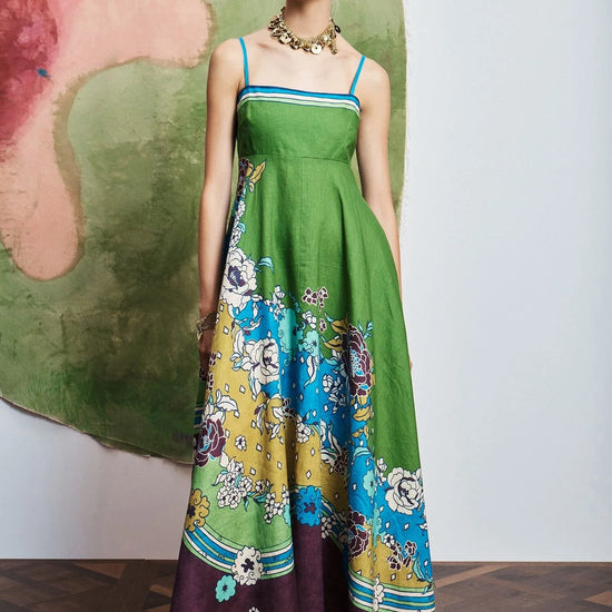Woman wearing pattern maxi dress by Alemais.