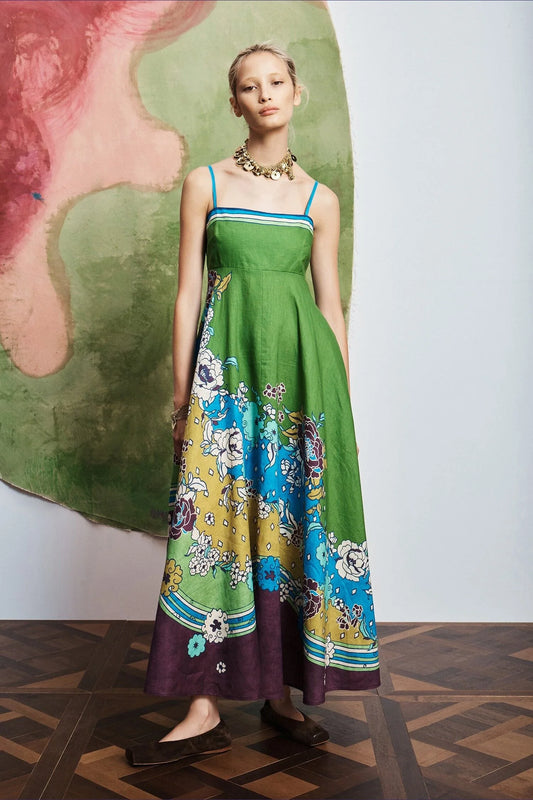 Woman wearing pattern maxi dress by Alemais.