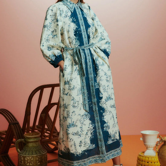 white shirtdress with blue delicate print and balloon sleeves with elasticated cuffs model shot