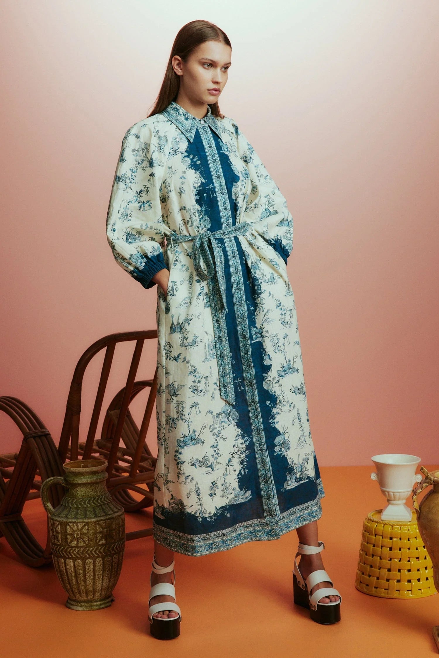 white shirtdress with blue delicate print and balloon sleeves with elasticated cuffs model shot