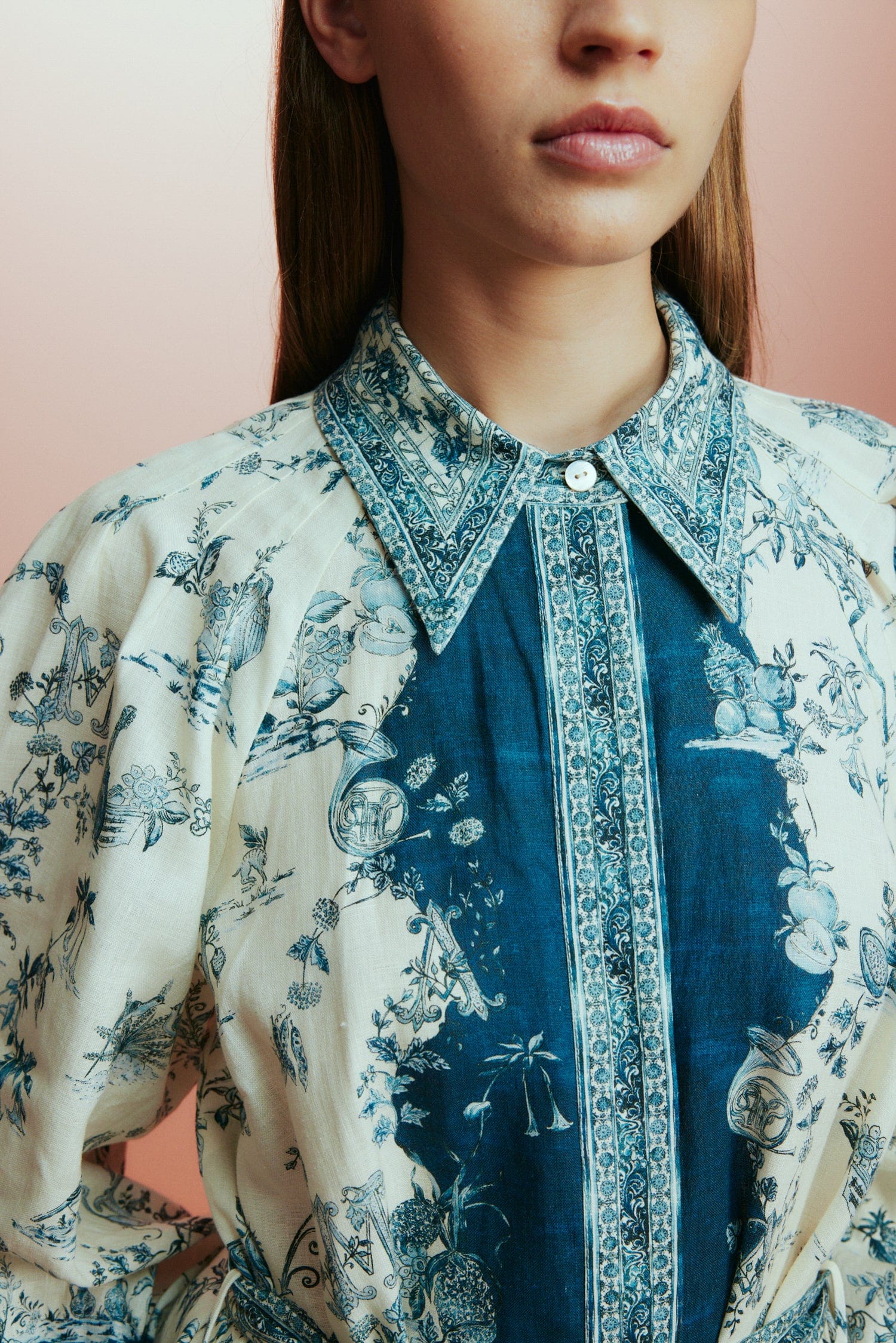 white shirtdress with blue delicate print and balloon sleeves with elasticated cuffs close up