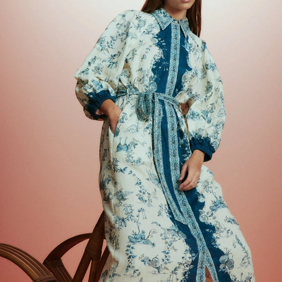 white shirtdress with blue delicate print and balloon sleeves with elasticated cuffs model shot